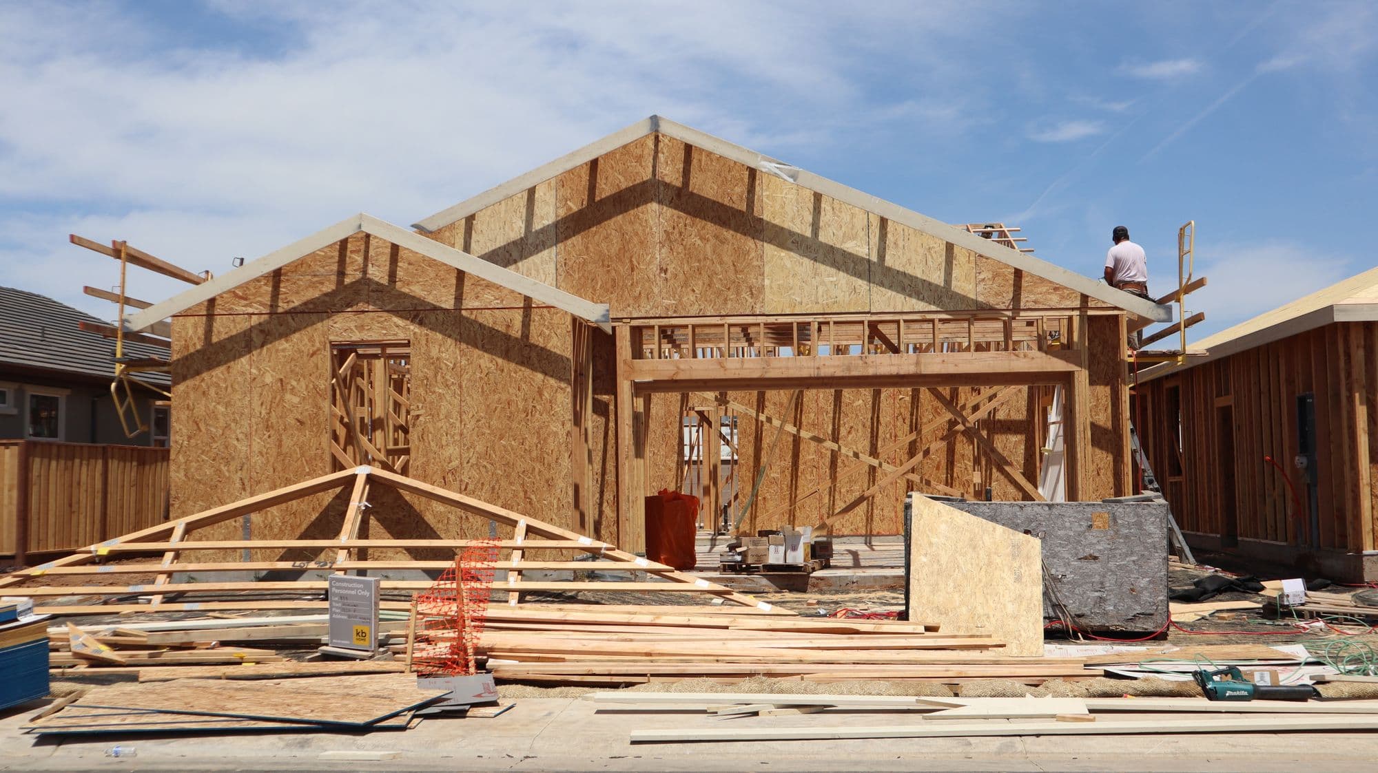 A new house framed and sheathed, before the plumbing rough-in